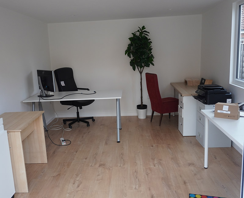 Furnished garden workspace with desk and office chair