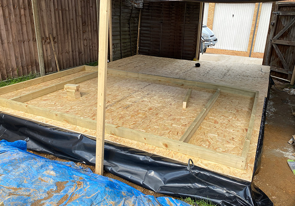 Garden office floor deck laid over a damp-proof membrane