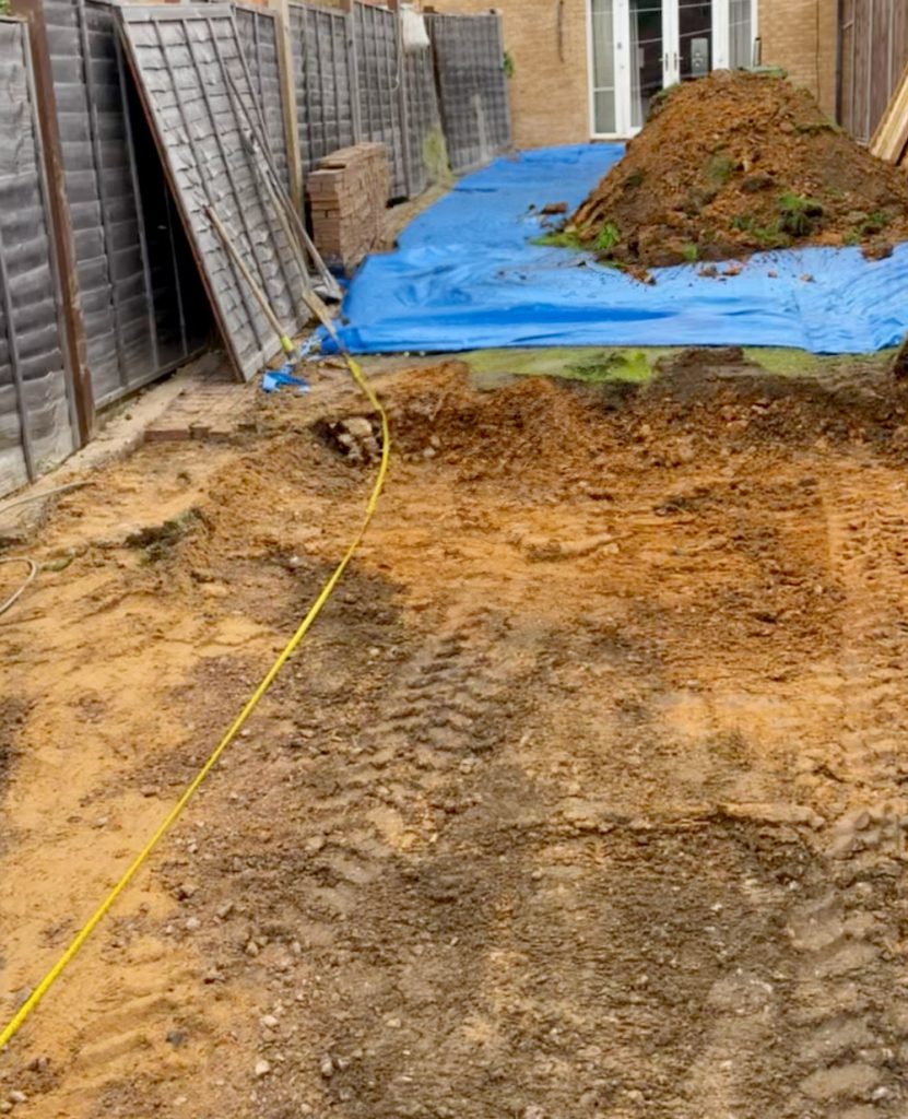 Excavated garden area marked out for the office base
