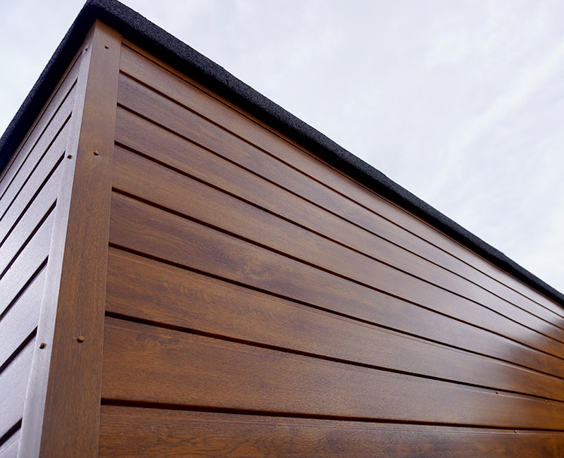 Finished flat roof edge and fascia above timber cladding