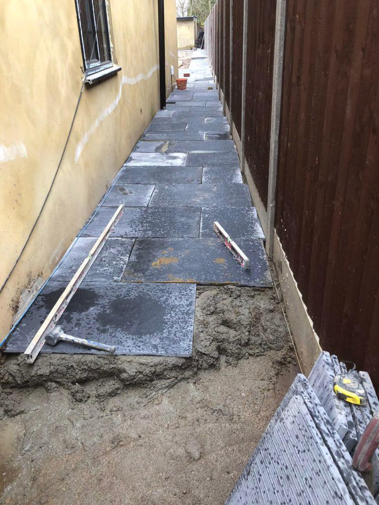New paving along the side passage beside the house